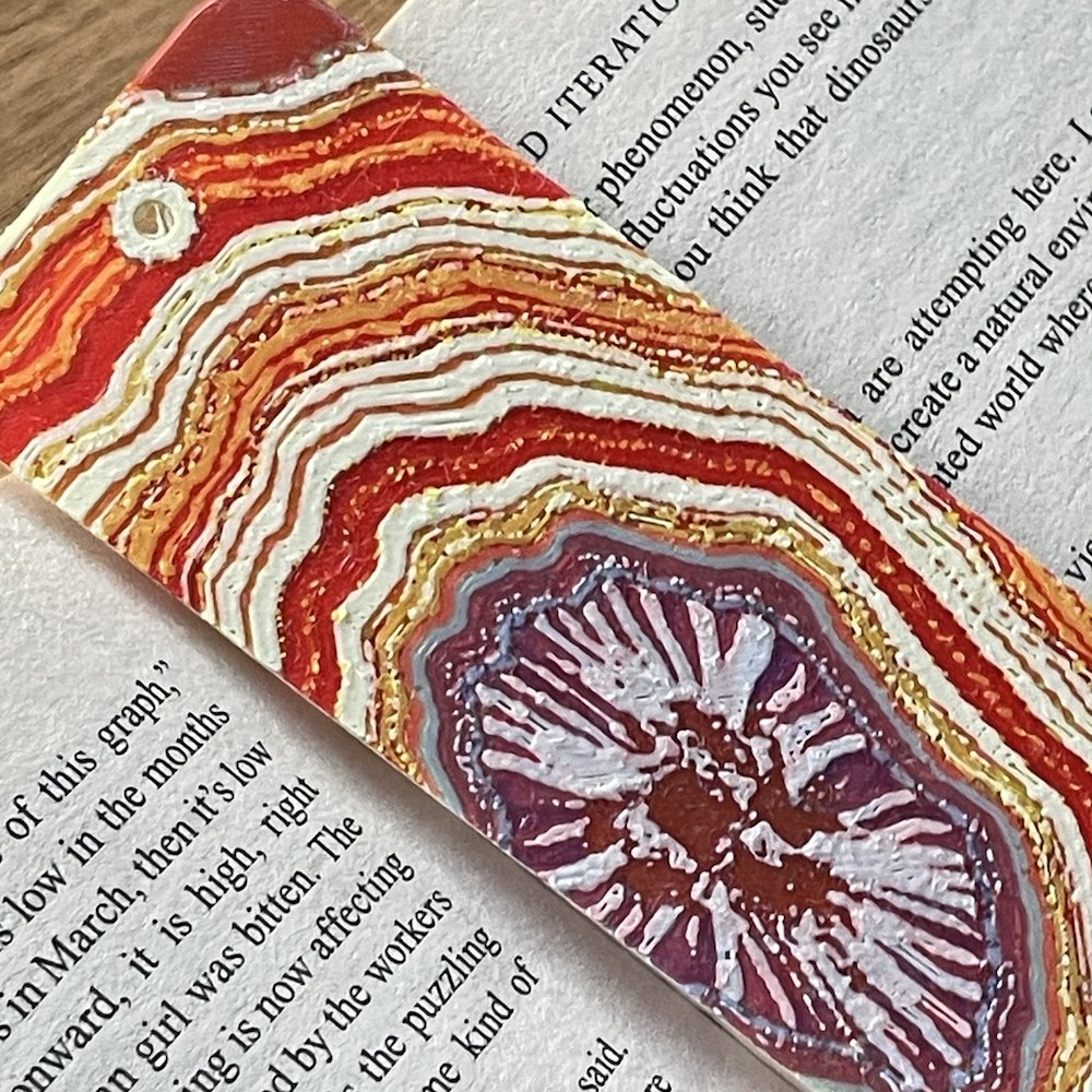 An unretouched close-up of my agate bookmark, showing fine bands of colour
