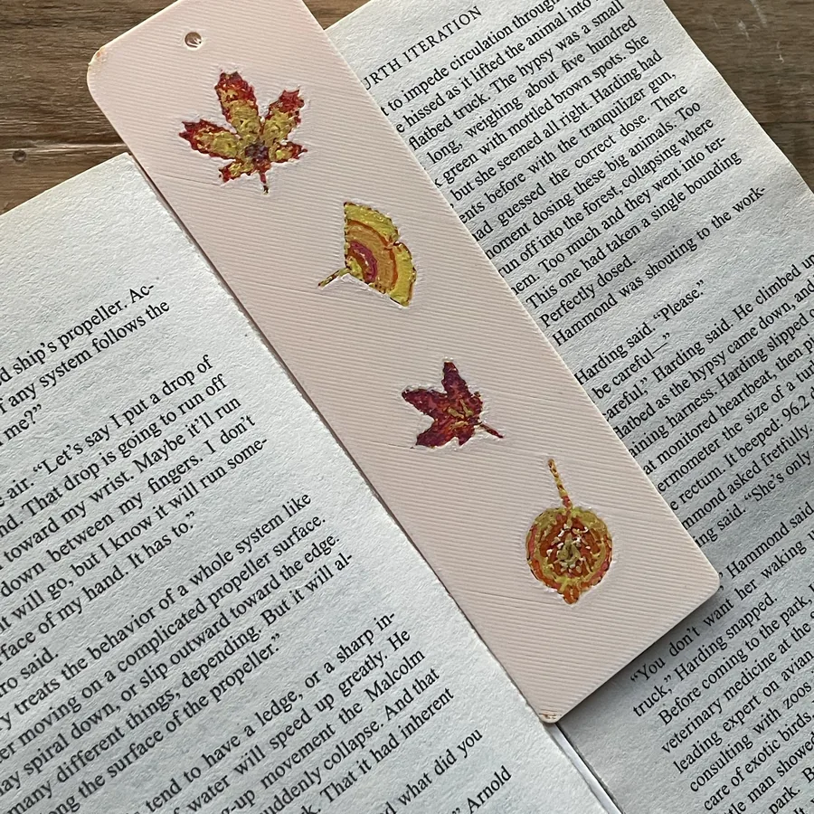 My Polychrome bookmark of four autumn leaves in an open book