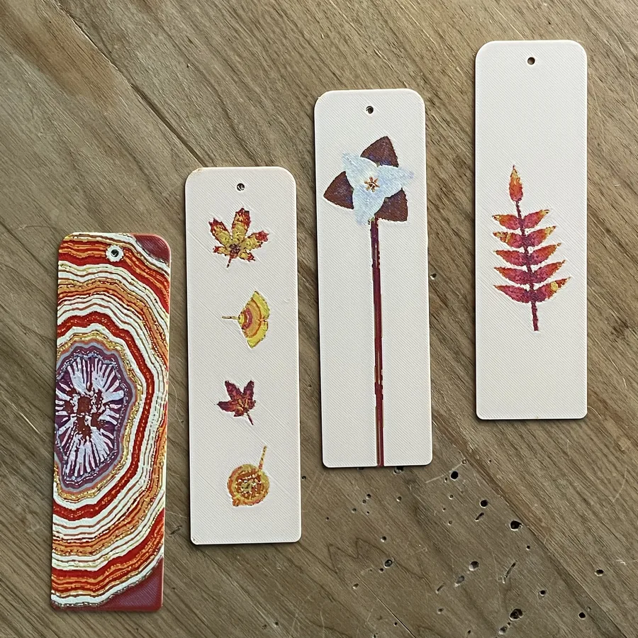 Four of my Polychrome autumn bookmarks on a wooden table