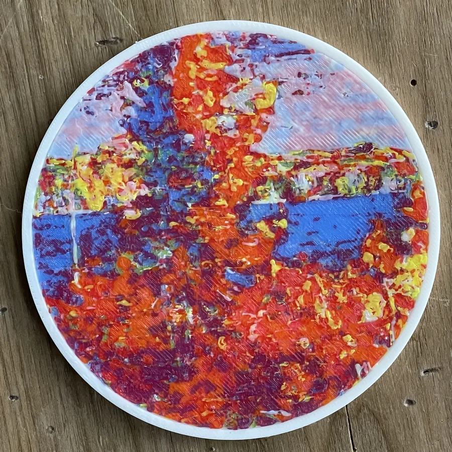 My Polychrome coaster of a Tom Thomson autumn lake on a wooden table
