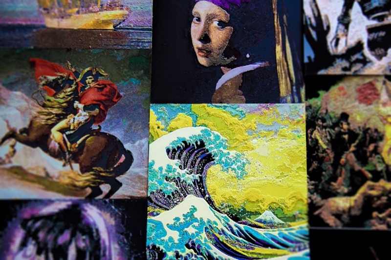 My Polychrome prints laid out together: The Great Wave, Girl with a Pearl Earring, Napoleon Crossing the Alps, a tall ship and more